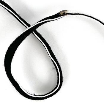 An overhand loop to the left of the midpoint.