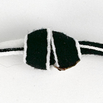 the back side of a double OH knot