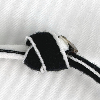 the cross or front side of a double OH knot